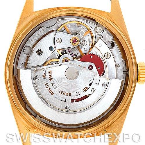The image shows the movement and inner workings of a Rolex President 18038 Men
s Yellow Gold Champagne Dial 18038 Men
s Yellow Gold Champagne Dial model watch from a back angle.