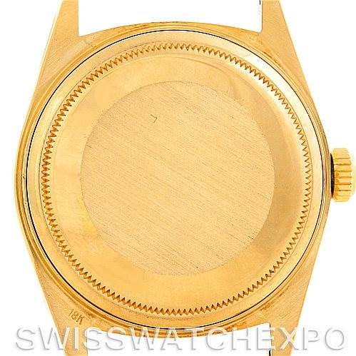 This image shows the back case and crown of a Rolex President 18038 Men
s Yellow Gold Champagne Dial 18038 Men
s Yellow Gold Champagne Dial model watch.