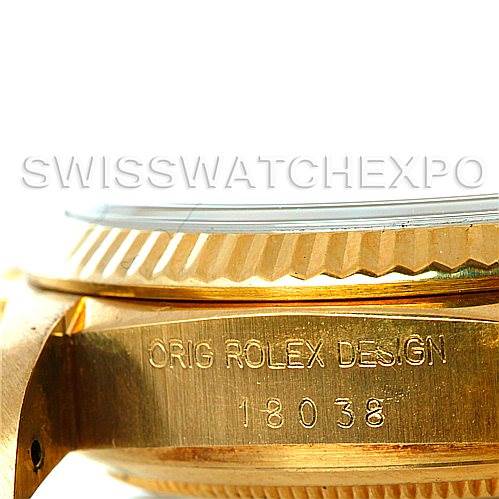 Close-up of the side of a Rolex President 18038 Men
s Yellow Gold Champagne Dial 18038 Men
s Yellow Gold Champagne Dial watch, showing part of the bezel and the engraved case with model number 18038.