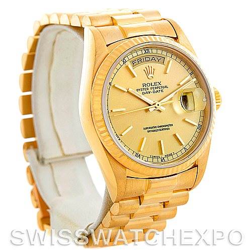 The Rolex President 18038 Men
s Yellow Gold Champagne Dial 18038 Men
s Yellow Gold Champagne Dial model is shown at a slight angle, displaying its gold bracelet, face, and bezel with the day and date features.