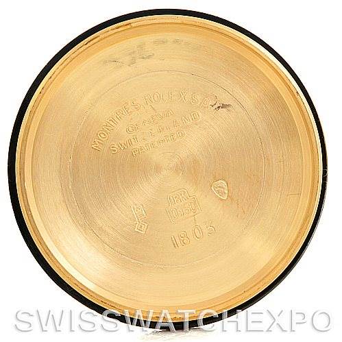 This image shows the inside case back of a Rolex President 1803 Men's Yellow Gold Silver Dial 1803 Men's Yellow Gold Silver Dial watch, with various engravings and hallmarks visible.