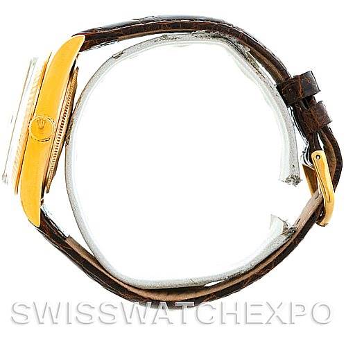 The Rolex President 1803 Men's Yellow Gold Silver Dial 1803 Men's Yellow Gold Silver Dial model watch is shown from a side angle, highlighting the case, bezel, and leather strap.