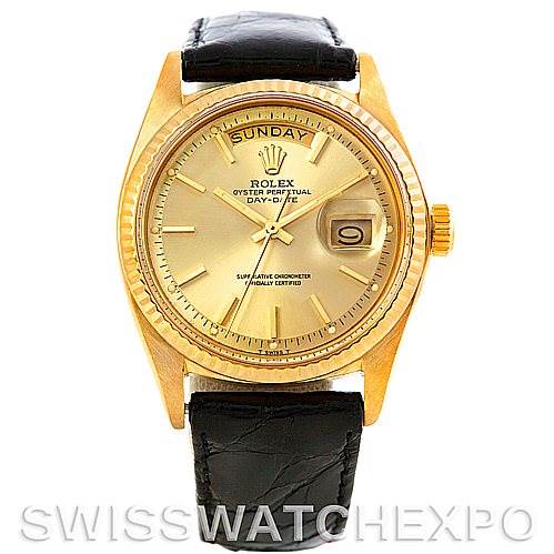 This is a front view of a Rolex President 1803 Men
s Yellow Gold Champagne Dial 1803 Men
s Yellow Gold Champagne Dial model watch, displaying its gold case, day-date feature, and black leather strap.