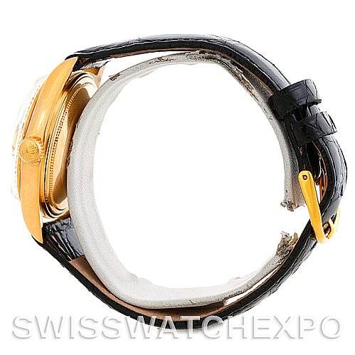 This side view of the Rolex President 1803 Men
s Yellow Gold Champagne Dial 1803 Men
s Yellow Gold Champagne Dial model watch showcases its gold casing and a black leather strap.