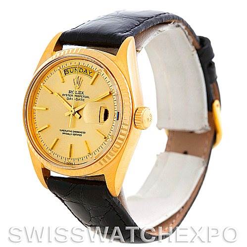 The image shows a Rolex President 1803 Men
s Yellow Gold Champagne Dial 1803 Men
s Yellow Gold Champagne Dial model watch at an angle highlighting the gold case, black leather strap, and day-date display.