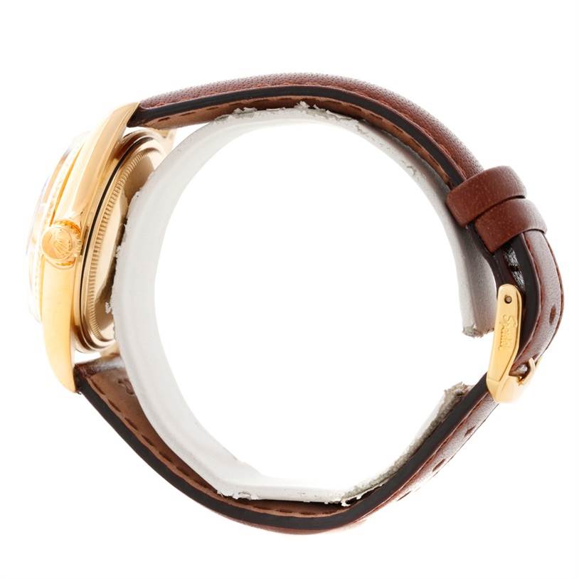 The Rolex President 1803 Men
s Yellow Gold Champagne Dial 1803 Men
s Yellow Gold Champagne Dial model watch is shown from a side view, highlighting its case, crown, and brown leather strap with a gold buckle.