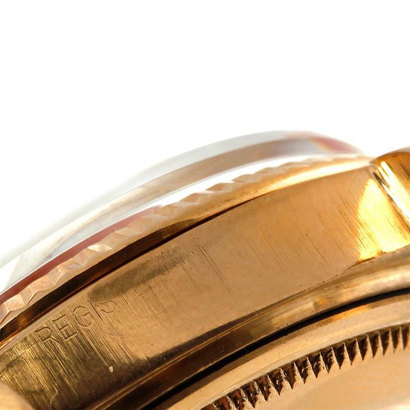 This close-up image of a Rolex President 1803 Men
s Yellow Gold Champagne Dial 1803 Men
s Yellow Gold Champagne Dial model watch shows part of the gold case and the edge of the crystal.
