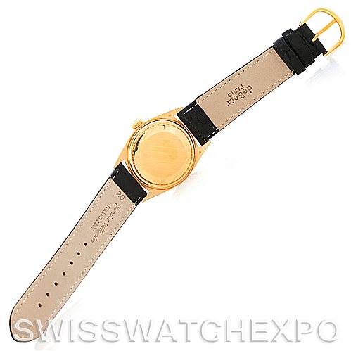 This image shows the back and strap of a Rolex President 1803 Men
s Yellow Gold White Dial 1803 Men
s Yellow Gold White Dial model watch, featuring a gold case and black leather strap.