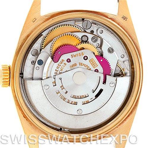 The image shows the internal mechanics of a Rolex President 1803 Men
s Yellow Gold White Dial 1803 Men
s Yellow Gold White Dial model watch, focusing on the movement and gears.
