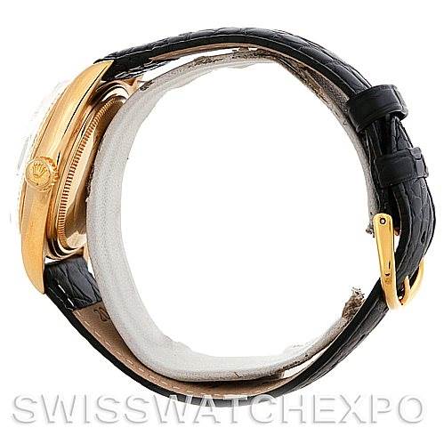 The image shows a side profile of a Rolex President 1803 Men
s Yellow Gold White Dial 1803 Men
s Yellow Gold White Dial model watch, highlighting its gold case and black leather strap with a gold buckle.