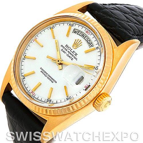 The image shows the face, bezel, crown, and part of the band of a Rolex President 1803 Men
s Yellow Gold White Dial 1803 Men
s Yellow Gold White Dial watch from an angled view.