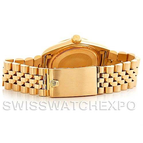 This image shows the case back and bracelet clasp of a Rolex President 1601 Men
s Yellow Gold Silver Dial 1601 Men
s Yellow Gold Silver Dial model watch viewed from the rear.