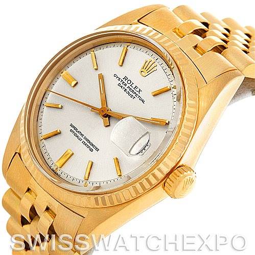This image shows a Rolex President 1601 Men
s Yellow Gold Silver Dial 1601 Men
s Yellow Gold Silver Dial watch at an angled view, highlighting its dial, bezel, crown, and bracelet.