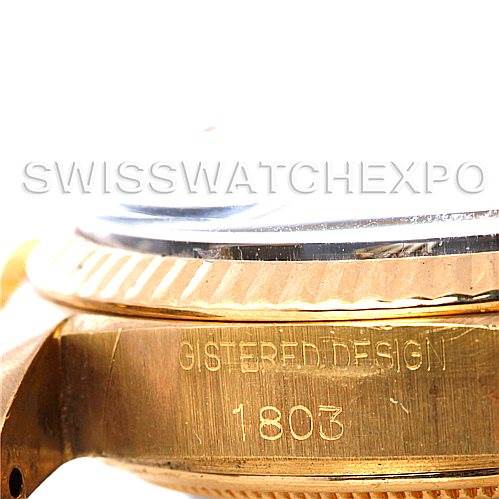 This close-up image of the Rolex President 1803 Men's Yellow Gold Black Dial 1803 Men's Yellow Gold Black Dial model shows the side of the case and part of the fluted bezel with engraved text and reference number 1803.