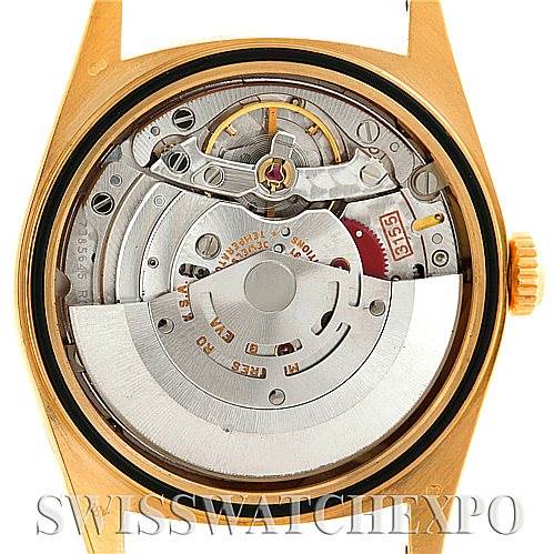 This image shows the internal mechanism of a Rolex President 18208 Men's Yellow Gold Black Dial 18208 Men's Yellow Gold Black Dial model watch, viewed from the back case with a focus on the rotor and movement parts.