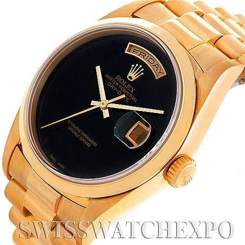 This image shows a close-up of the Rolex President 18208 Men's Yellow Gold Black Dial 18208 Men's Yellow Gold Black Dial model watch, highlighting its gold case, black dial, day-date display, and bracelet.