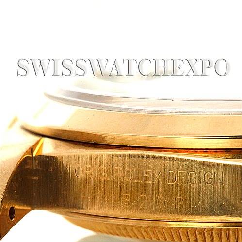 The image shows the side angle of a Rolex President 18208 Men's Yellow Gold Black Dial 18208 Men's Yellow Gold Black Dial watch, specifically focusing on the engraved case and part of the bezel.