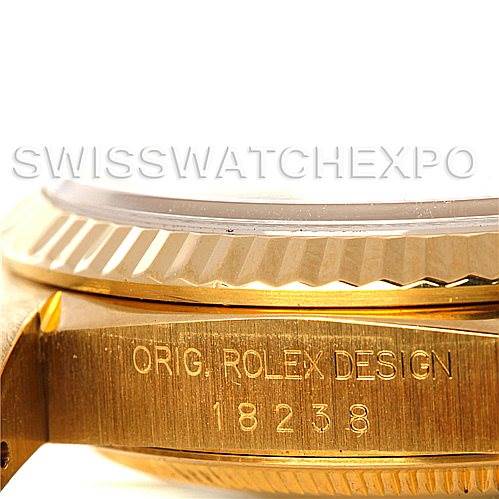 This image shows a detailed side view of the bezel and part of the case of a Rolex President 18238 Men
s Yellow Gold Champagne Dial 18238 Men
s Yellow Gold Champagne Dial 18238 watch with engravings visible.