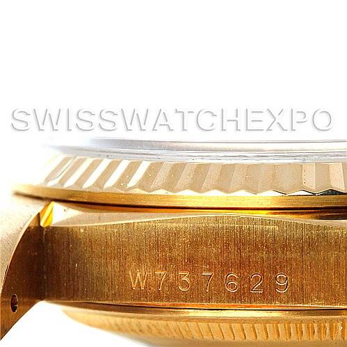 This image shows an angled close-up of the Rolex President 18238 Men
s Yellow Gold Champagne Dial 18238 Men
s Yellow Gold Champagne Dial model
s case side, serial number, and fluted bezel.