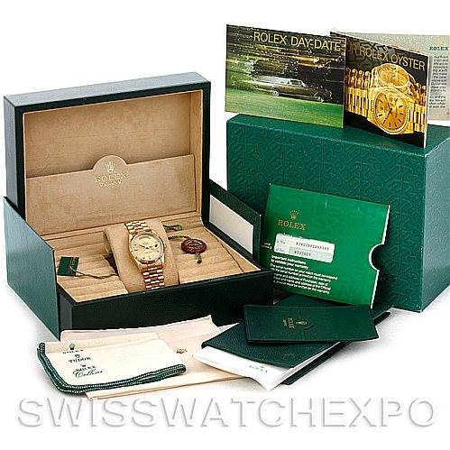 The image shows a Rolex President 18238 Men
s Yellow Gold Champagne Dial 18238 Men
s Yellow Gold Champagne Dial model watch and accessories at a front angle, including the watch, box, documents, and cleaning cloth.