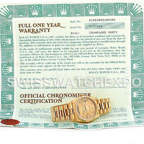 The image shows a Rolex President 18238 Men
s Yellow Gold Champagne Dial 18238 Men
s Yellow Gold Champagne Dial model watch laid flat on its side, along with its warranty and certification papers.