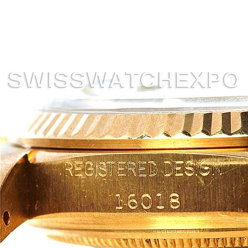 This image shows a close-up side view of the Rolex President 16018 Men
s Yellow Gold Silver Dial 16018 Men
s Yellow Gold Silver Dial model, displaying the "REGISTERED DESIGN" and model number "16018."