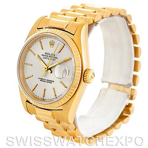 The image shows a Rolex President 16018 Men
s Yellow Gold Silver Dial 16018 Men
s Yellow Gold Silver Dial model watch from an angle that highlights the face, bezel, crown, and part of the band.