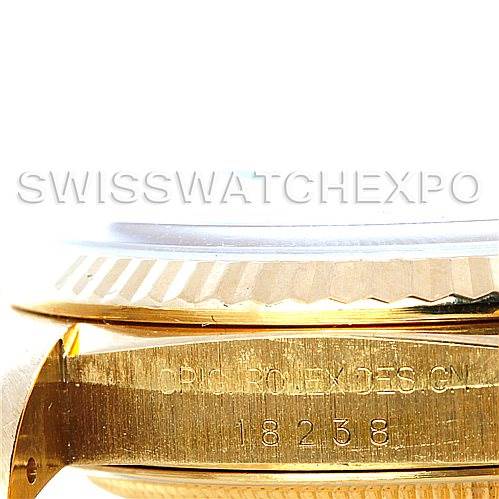 The image shows a close-up of the side of a Rolex President 18238 Men
s Yellow Gold Champagne Dial 18238 Men
s Yellow Gold Champagne Dial model watch, highlighting the bezel and case with the model number 18238.
