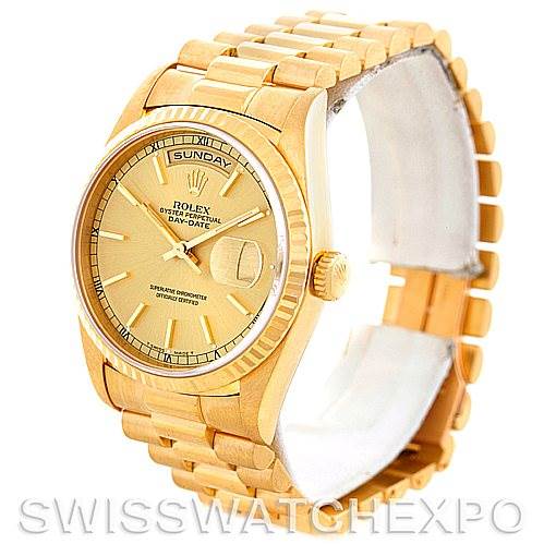 This image shows a Rolex President 18238 Men
s Yellow Gold Champagne Dial 18238 Men
s Yellow Gold Champagne Dial model watch at an angled view, highlighting its gold case, bracelet, and day-date display on the dial.