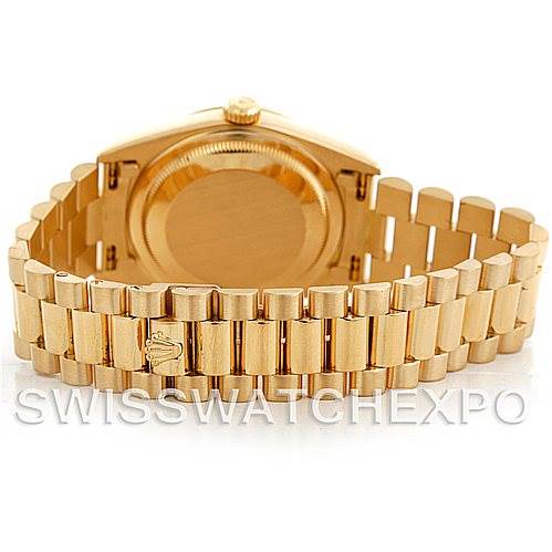 The image shows the back of a Rolex President 18238 Men
s Yellow Gold Champagne Dial 18238 Men
s Yellow Gold Champagne Dial model watch, focusing on the case back and the gold bracelet.