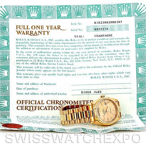 The image shows a Rolex President 18238 Men
s Yellow Gold Champagne Dial 18238 Men
s Yellow Gold Champagne Dial model watch placed in front of its warranty and certification documents.
