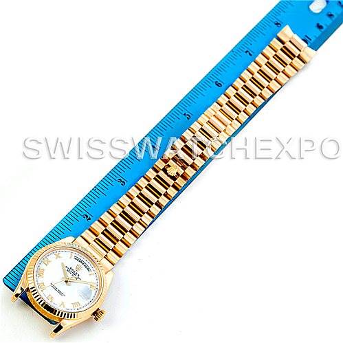 The image shows a Rolex President 118238 Men's Yellow Gold White Dial 118238 Men's Yellow Gold White Dial model watch laid out flat alongside a ruler, displaying the bracelet and watch face.