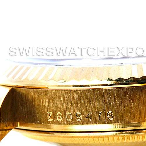 This close-up image shows the side of the bezel and part of the case, including the serial number, of a Rolex President 118238 Men's Yellow Gold White Dial 118238 Men's Yellow Gold White Dial model.