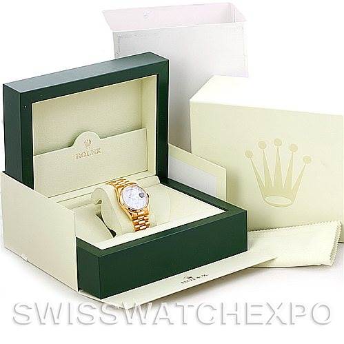 The image shows a Rolex President 118238 Men's Yellow Gold White Dial 118238 Men's Yellow Gold White Dial model watch in its green and beige box, with additional packaging and a cleaning cloth.