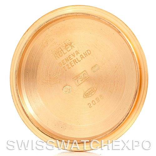 The image shows the inside of the case back of a Rolex President 118238 Men's Yellow Gold White Dial 118238 Men's Yellow Gold White Dial model watch, featuring various engravings.