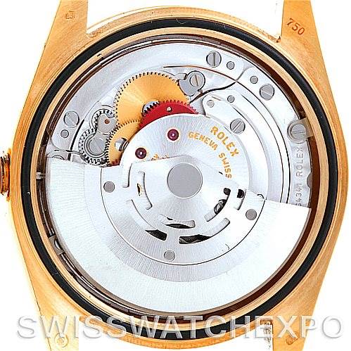 This image shows the intricate internal mechanism and movement of the Rolex President 118238 Men's Yellow Gold White Dial 118238 Men's Yellow Gold White Dial model watch from a back angle, revealing gears and components.