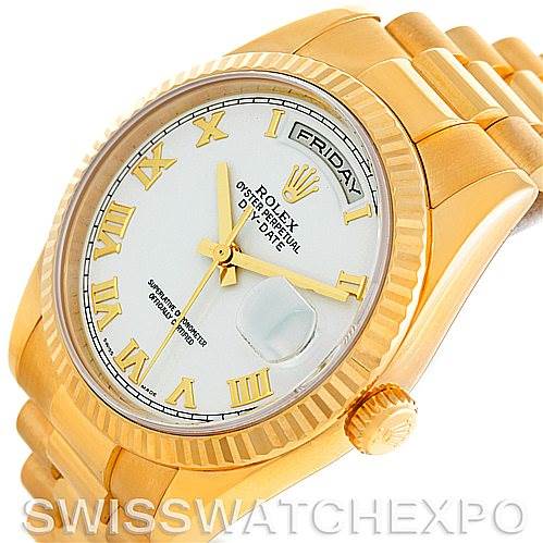 The image shows a close-up angle of a Rolex President 118238 Men's Yellow Gold White Dial 118238 Men's Yellow Gold White Dial model watch, featuring its golden bezel, white dial, and day-date display.