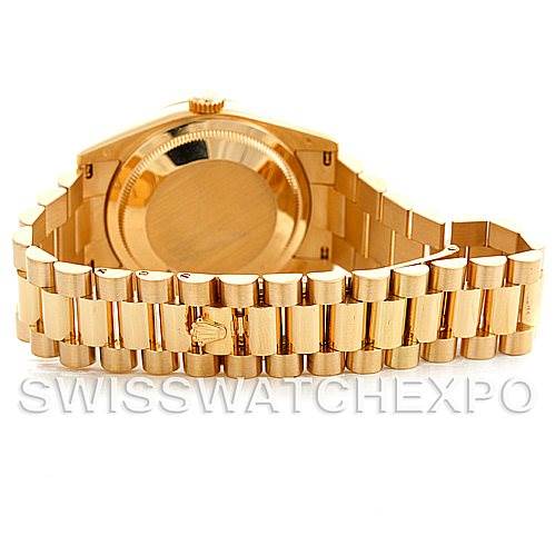 The image shows the back view of a Rolex President 118238 Men's Yellow Gold White Dial 118238 Men's Yellow Gold White Dial model watch, featuring its gold case and linked bracelet.