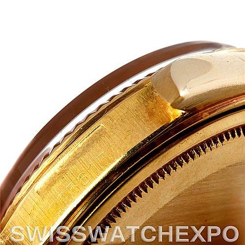 This image shows a close-up of the side casing and bezel of a Rolex President 1803 Men's Yellow Gold White Dial 1803 Men's Yellow Gold White Dial model watch, highlighting the gold-tone finish and serrated edges.