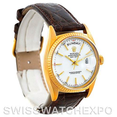 The image shows a Rolex President 1803 Men's Yellow Gold White Dial 1803 Men's Yellow Gold White Dial model watch at an angle highlighting the face, crown, and brown leather strap.