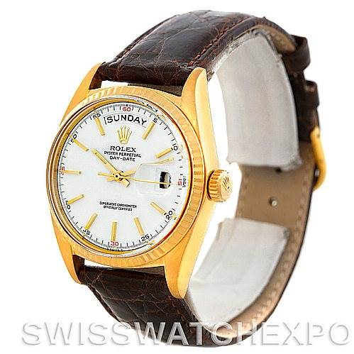 This image shows a Rolex President 1803 Men's Yellow Gold White Dial 1803 Men's Yellow Gold White Dial watch at a three-quarter angle, highlighting its gold case, white dial, brown leather strap, and day-date feature.