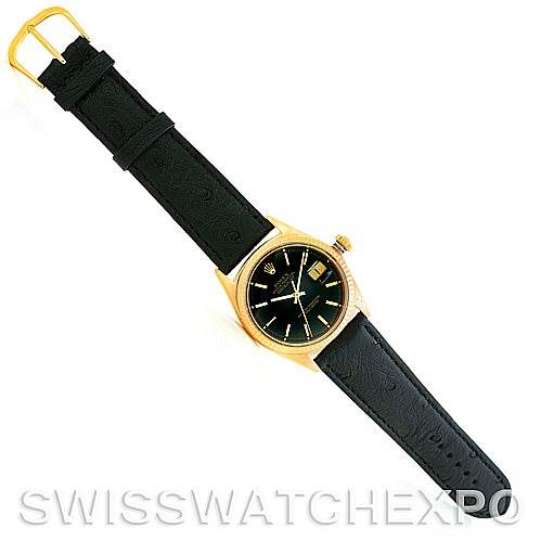 The image shows a Rolex President 1601 Men's Yellow Gold Black Dial 1601 Men's Yellow Gold Black Dial model watch viewed from a top-down angle, displaying the entire watch including the black leather strap and gold buckle.