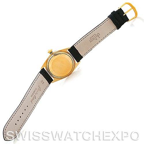 The image shows the back and strap of a Rolex President 1601 Men's Yellow Gold Black Dial 1601 Men's Yellow Gold Black Dial model watch, positioned at an overhead angle.