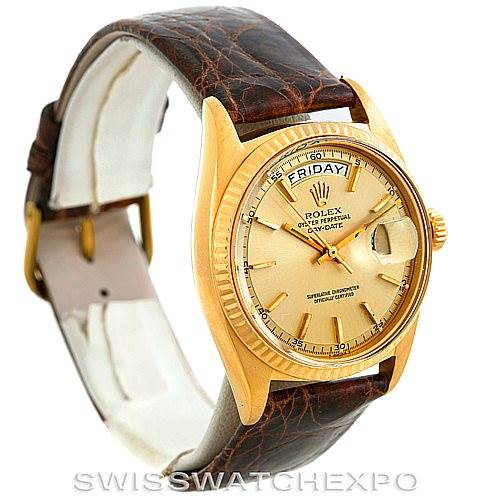 The image shows a Rolex President 1803 Men
s Yellow Gold Champagne Dial 1803 Men
s Yellow Gold Champagne Dial model watch in a three-quarter left angle, highlighting its dial, bezel, and leather strap.