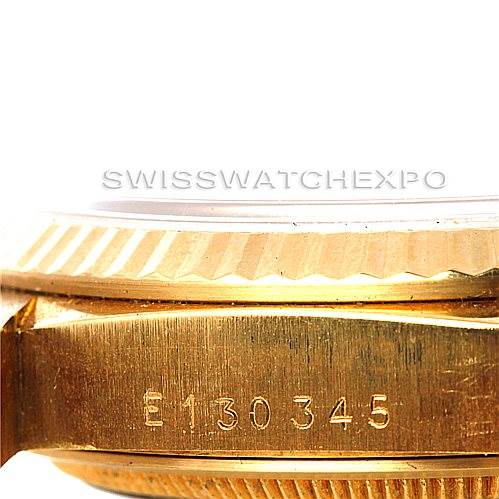 This close-up side angle of the Rolex President 18238 Men's Yellow Gold Beige Dial 18238 Men's Yellow Gold Beige Dial model watch shows the case with serial number E130345 and the fluted bezel.
