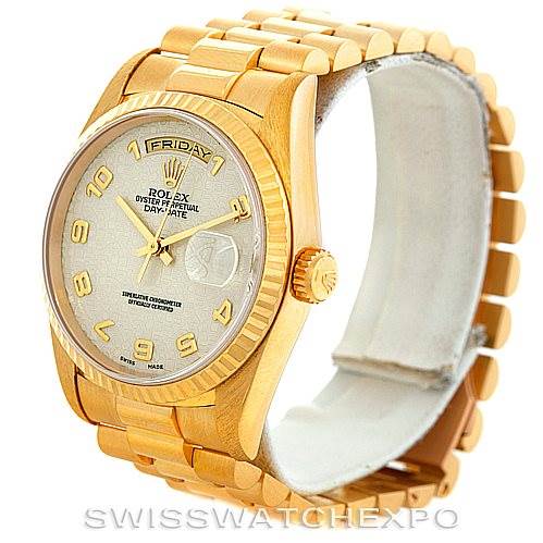 The image shows a side angle of a Rolex President 18238 Men's Yellow Gold Beige Dial 18238 Men's Yellow Gold Beige Dial model watch, highlighting its gold case, bracelet, and dial with day and date functions.