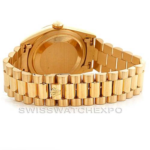 The image shows the back angle of a Rolex President 18238 Men's Yellow Gold Beige Dial 18238 Men's Yellow Gold Beige Dial model watch, highlighting the gold bracelet and caseback.