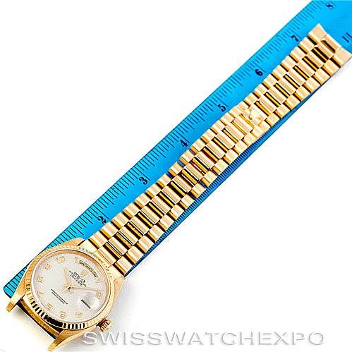 The image shows a Rolex President 18238 Men's Yellow Gold Beige Dial 18238 Men's Yellow Gold Beige Dial model watch laid flat with its bracelet extended next to a blue ruler for measurement.