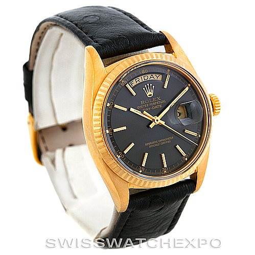 This image shows the Rolex President 1803 Men's Yellow Gold Grey Dial 1803 Men's Yellow Gold Grey Dial model watch from an angled front view, displaying the black dial, day-date windows, and leather strap.