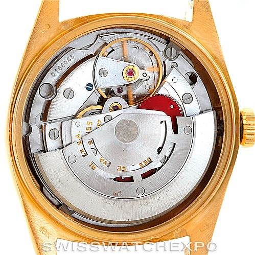 The image shows the internal mechanism and movement of a Rolex President 18038 Men's Yellow Gold Brown Dial 18038 Men's Yellow Gold Brown Dial model watch from a rear angle.